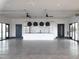 Modern community kitchen features stainless steel appliances and an expansive island at 1073 Channel Drop Lp, Zebulon, NC 27597