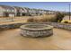 Stone fire pit perfect for community gatherings at 1073 Channel Drop Lp, Zebulon, NC 27597