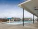 Community pool with cabana and surrounding homes visible at 1073 Channel Drop Lp, Zebulon, NC 27597