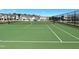 Community tennis court with surrounding homes visible at 1073 Channel Drop Lp, Zebulon, NC 27597