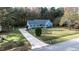 One-story house with driveway and yard, viewed from above at 108 Yorkbury Dr, Clayton, NC 27527