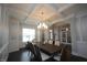 Bright dining room with hardwood floors, chandelier, and access to the kitchen at 3053 Thurman Dairy Loop, Wake Forest, NC 27587