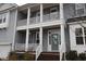 Gray house with a white front door and porch at 3053 Thurman Dairy Loop, Wake Forest, NC 27587