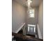 Elegant two-story foyer featuring a dramatic chandelier and hardwood floors at 3053 Thurman Dairy Loop, Wake Forest, NC 27587