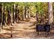 Paved trail in Raven Rock State Park with mileage markers at 160 Blue Butterfly Dr, Angier, NC 27501