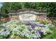 Community entrance sign with stonework and colorful landscaping at 2808 Corbett Grove Dr, Raleigh, NC 27616