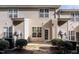 Back exterior view of townhouses with patios and landscaping at 2808 Corbett Grove Dr, Raleigh, NC 27616