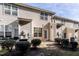 Back exterior view showing multiple townhouses and individual patios at 2808 Corbett Grove Dr, Raleigh, NC 27616