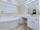 Bathroom with a large garden tub and double vanity at 206 Arbor Dr, Elon, NC 27244