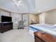 Spacious main bedroom with a king-size bed, sitting area, and large windows at 206 Arbor Dr, Elon, NC 27244