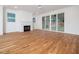 Spacious living room with hardwood floors, fireplace, and sliding glass doors at 1223 Chaney Rd, Raleigh, NC 27606