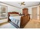 Large bedroom with a wooden sleigh bed and ample closet space at 109 Peggy Ct, Rocky Mount, NC 27803