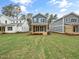 New homes with a shared backyard and grassy lawn at 1223 Chaney Rd, Raleigh, NC 27606