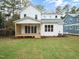 White two-story house with backyard and deck at 1227 Chaney Rd, Raleigh, NC 27606