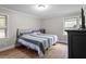 Spacious bedroom with a king-size bed and wood floors at 307 S Arendell Ave, Zebulon, NC 27597