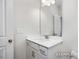 Clean bathroom with vanity, sink and mirror at 317 Highland Ridge Ln, Knightdale, NC 27545