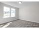 Bright bedroom with neutral walls and carpet flooring at 317 Highland Ridge Ln, Knightdale, NC 27545