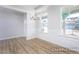 Elegant dining room with chandelier and wainscoting at 317 Highland Ridge Ln, Knightdale, NC 27545