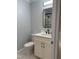 Modern bathroom with white vanity, marble shower, and black fixtures at 352 Faucette Mill Rd, Hillsborough, NC 27278