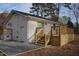 Back of the house showcasing a large deck and a gravel pathway at 352 Faucette Mill Rd, Hillsborough, NC 27278