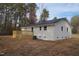 Back of house showing a newly-built wooden deck and spacious backyard at 352 Faucette Mill Rd, Hillsborough, NC 27278