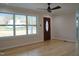 Living room with hardwood floors and large window at 352 Faucette Mill Rd, Hillsborough, NC 27278