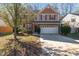 Two-story house with stone accents and a two-car garage at 552 Stobhill Ln, Holly Springs, NC 27540