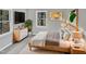 Virtually staged bedroom with a comfortable bed and plenty of natural light at 615 Wildaro Ct, Hillsborough, NC 27278
