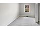 Spacious bedroom with plush carpeting and large window at 615 Wildaro Ct, Hillsborough, NC 27278