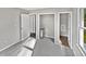 Spacious bedroom with grey carpet, closet, and access to hallway at 615 Wildaro Ct, Hillsborough, NC 27278