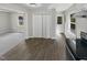 Bright kitchen features wood-look floors and access to the backyard at 615 Wildaro Ct, Hillsborough, NC 27278