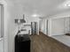 Modern kitchen featuring stainless steel appliances and wood-look flooring at 615 Wildaro Ct, Hillsborough, NC 27278