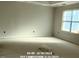 Empty bedroom with a large window and white walls at 78 Bennett Rd, Coats, NC 27521