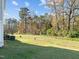 Private backyard with grassy area and mature trees at 918 E Green St # A102, Franklinton, NC 27525