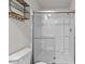 Walk-in shower with glass enclosure and shelving at 918 E Green St # A102, Franklinton, NC 27525