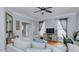 Bright living room featuring hardwood floors, a comfy sectional sofa, and a home office area at 1012 Maple Ridge Ct, Burlington, NC 27217
