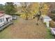 Large backyard with mature trees and a storage shed at 124 Jack Bennett Rd, Chapel Hill, NC 27517