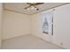 Simple bedroom with a window and ceiling fan at 124 Jack Bennett Rd, Chapel Hill, NC 27517
