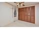 Bright bedroom featuring ample closet space and carpeted floors at 124 Jack Bennett Rd, Chapel Hill, NC 27517