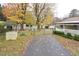 Driveway and yard with wishing well at 124 Jack Bennett Rd, Chapel Hill, NC 27517