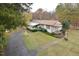 Ranch home with attached carport and landscaping at 124 Jack Bennett Rd, Chapel Hill, NC 27517