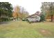 House exterior with a front porch and yard at 124 Jack Bennett Rd, Chapel Hill, NC 27517
