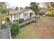 Ranch style home with ramp access, mature trees, and landscaping at 124 Jack Bennett Rd, Chapel Hill, NC 27517