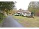 Ranch home with a fountain and long driveway at 124 Jack Bennett Rd, Chapel Hill, NC 27517