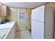 Kitchen features white refrigerator and wood cabinets at 124 Jack Bennett Rd, Chapel Hill, NC 27517