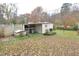 Yard with a storage shed and landscaping at 124 Jack Bennett Rd, Chapel Hill, NC 27517