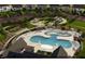 Community pool with lounge chairs, playground, and open green spaces at 2165 Pink Peony Cir # 230, Durham, NC 27703