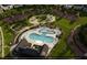 Community pool with lounge chairs, playground, and open green spaces at 2165 Pink Peony Cir # 230, Durham, NC 27703