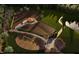 Fenced dog park with playground equipment and shaded seating area at 2165 Pink Peony Cir # 230, Durham, NC 27703