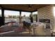Relaxing patio area with fireplace, seating, and dining tables at 2165 Pink Peony Cir # 230, Durham, NC 27703